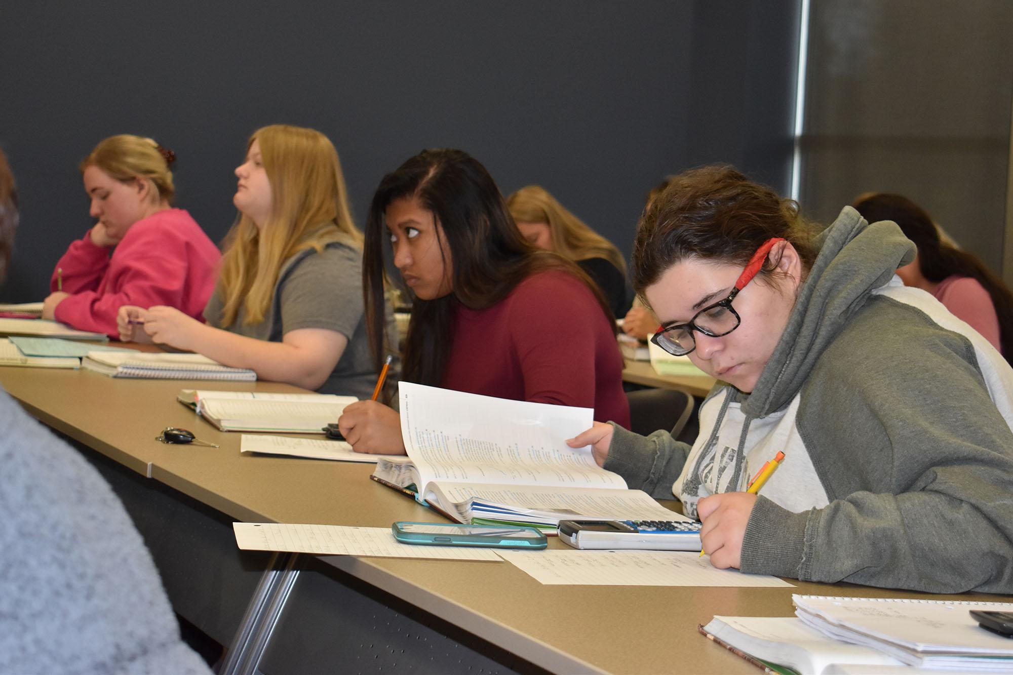 A classroom full of students working on an assignment